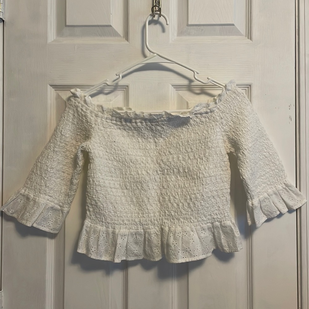 White off-shoulder top with stretch and eyelet-floral detailing